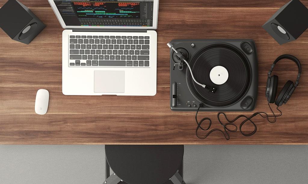 Modern computer technology workspace with multiple monitors and devices