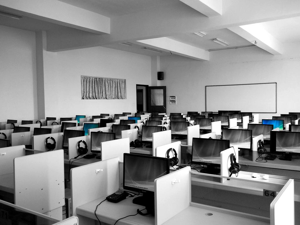 Students learning on laptops in a modern classroom